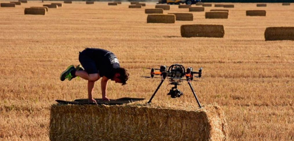 Chris WIlkinson from Upper Cut Productions doing yoga with drone